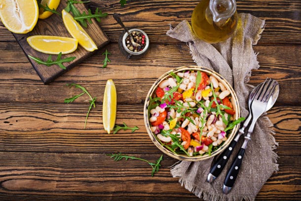 White bean cannellini salad. Vegan salad. Diet menu. Flat lay. Top view. White bean cannellini salad. Vegan salad. Diet menu. Flat lay. Top view.
